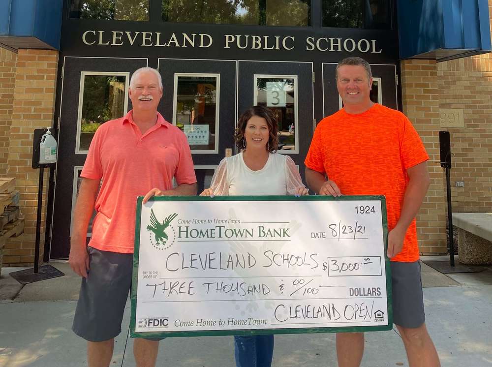 People holding big check