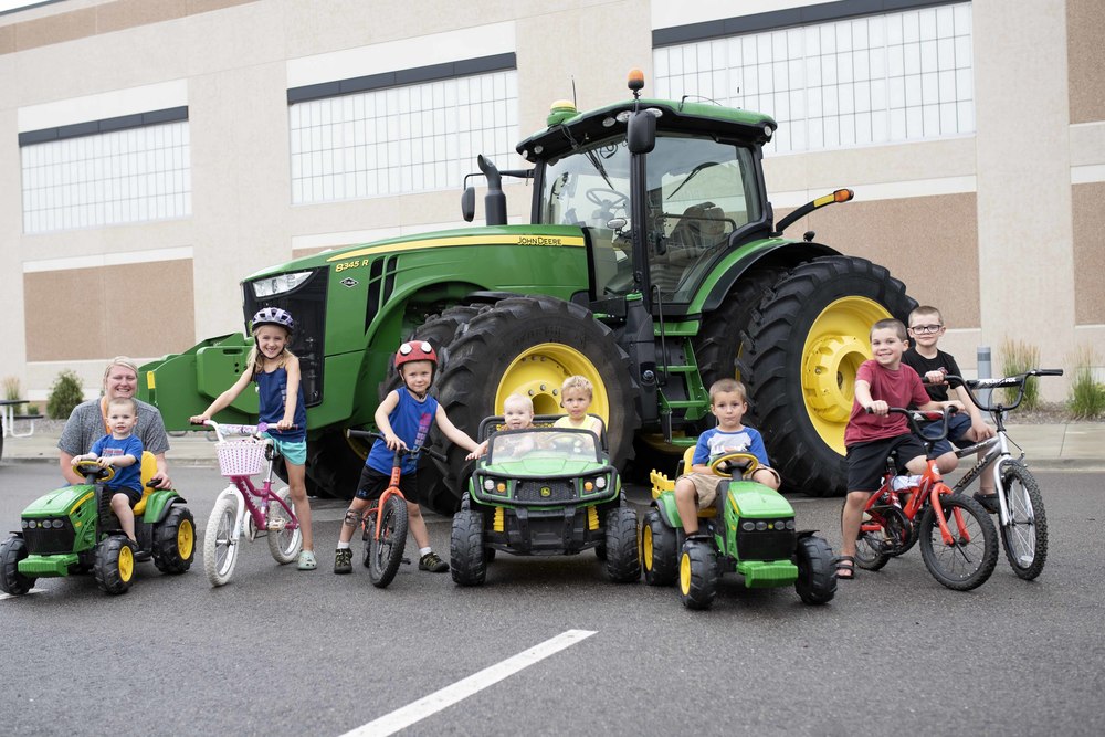 Kids by a tractor