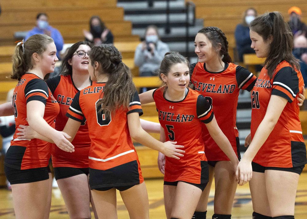 The eighth grade girls celebrate after winning a point.