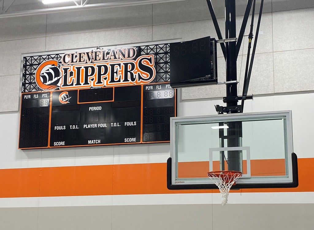 picture of scoreboard, and basketball hoop.